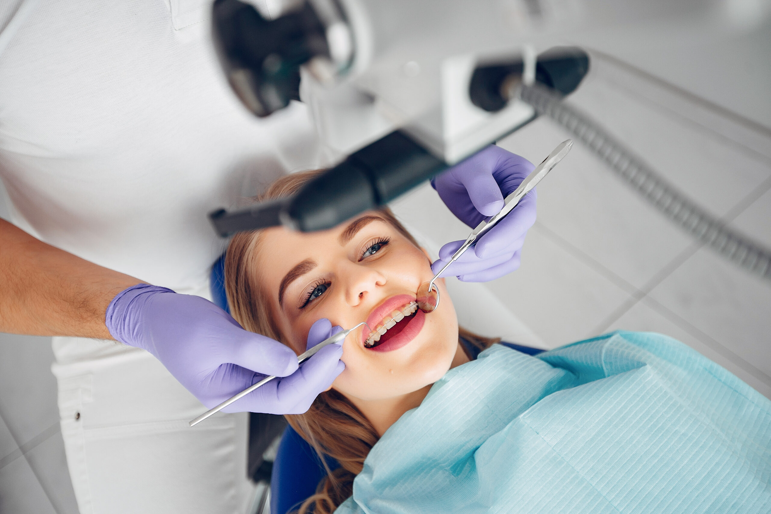 Beautiful lady in the dentist's office. Woman in a uniform